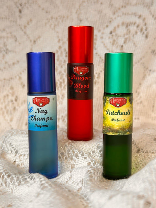 Perfume Roll-On Trio featuring three 10ML bottles of Nag Champa, Dragon’s Blood, and Patchouli fragrances. Perfect for gifting or everyday use.